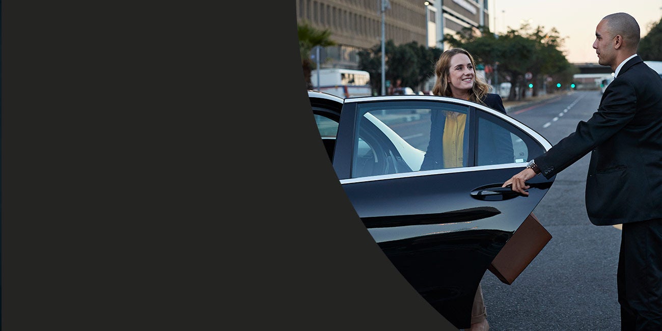 Driver opening door for business