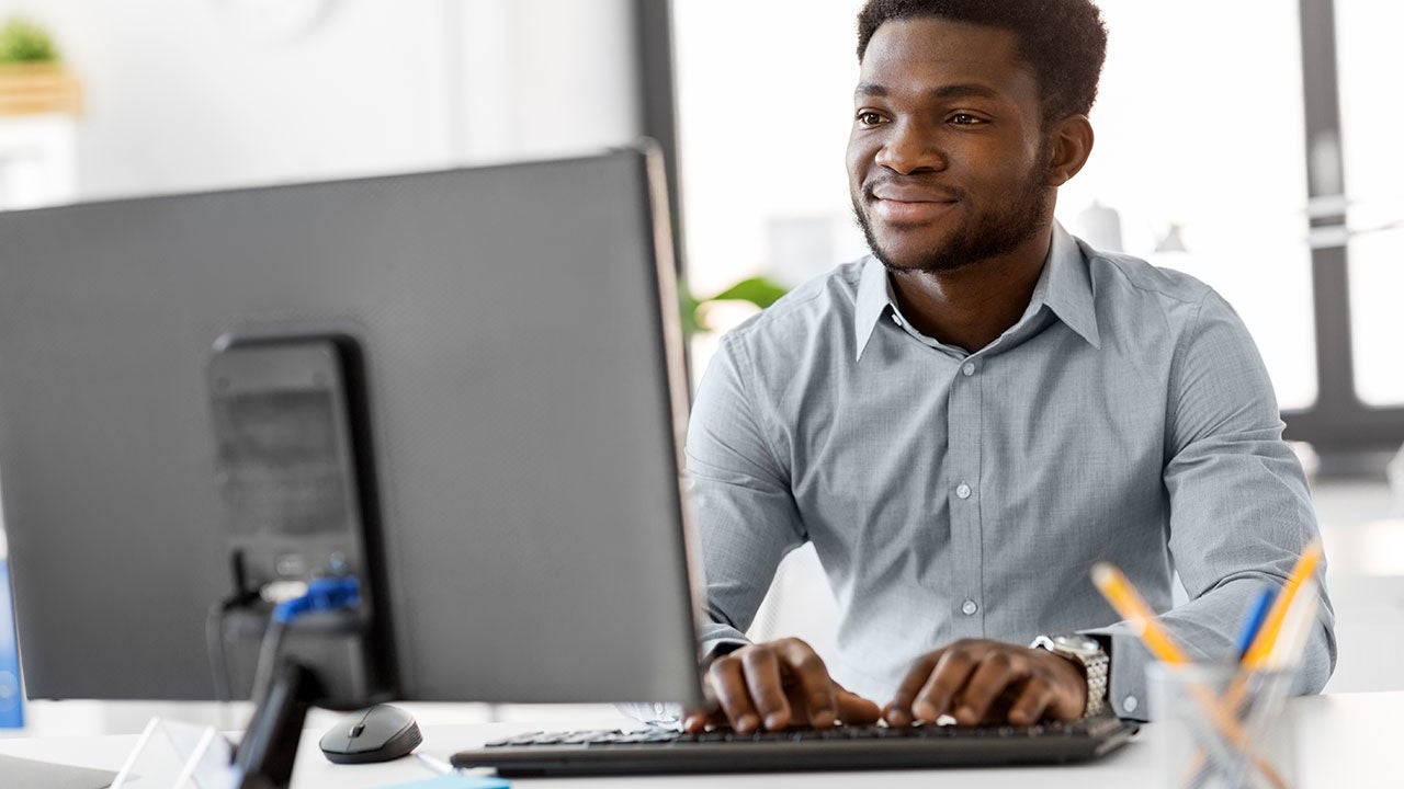 Businessman working on laptop.