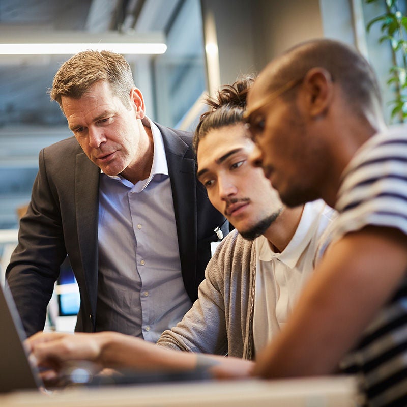 Two people running in a hallway with motion blur to simulate speed