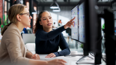 Two women looking at a laptop