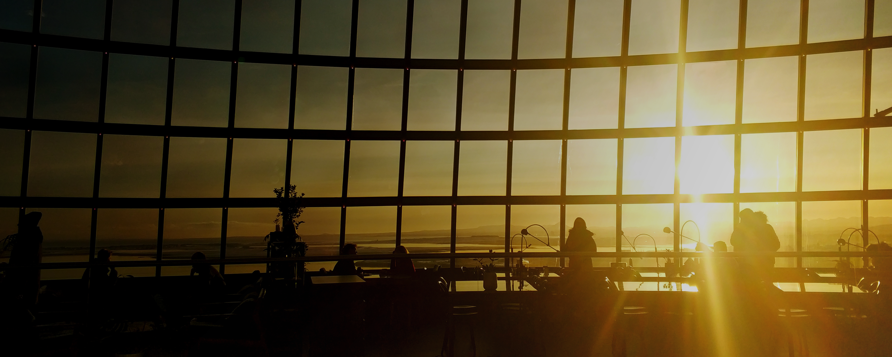 The large glass facade of a spherical museum in Reykjavik. Attraction number 1 in Reykjavik