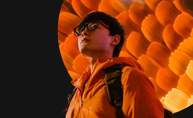 Man wearing orange jacket.