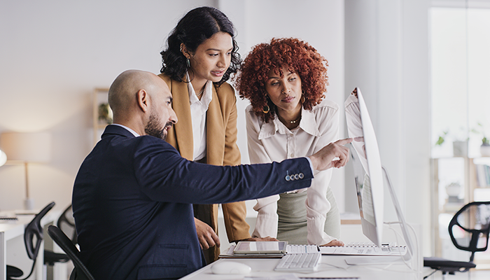 Woman in a coffee shop holding her coffee smiling