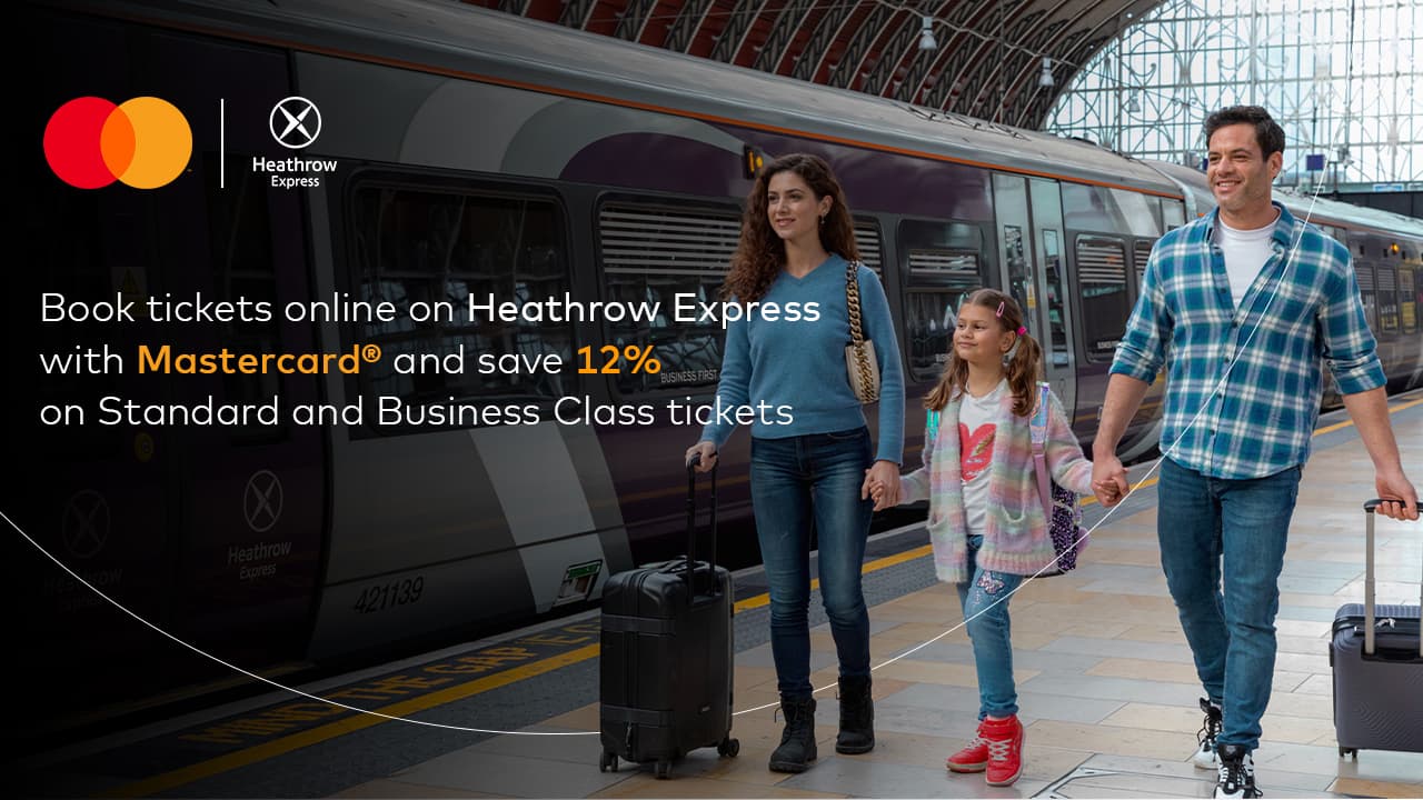 family walking along train platform