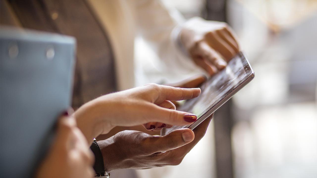 Customer paying with card on a tablet