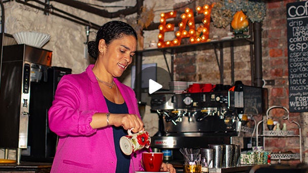 Woman pouring coffee in a restaurant
