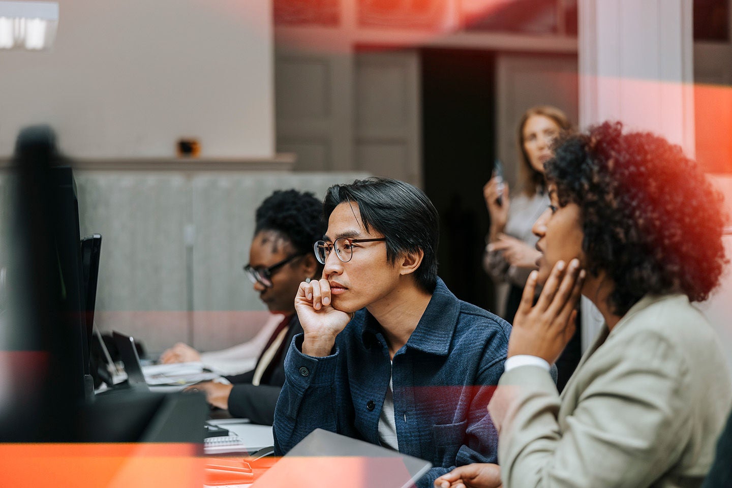 People attentively listening to a lecture