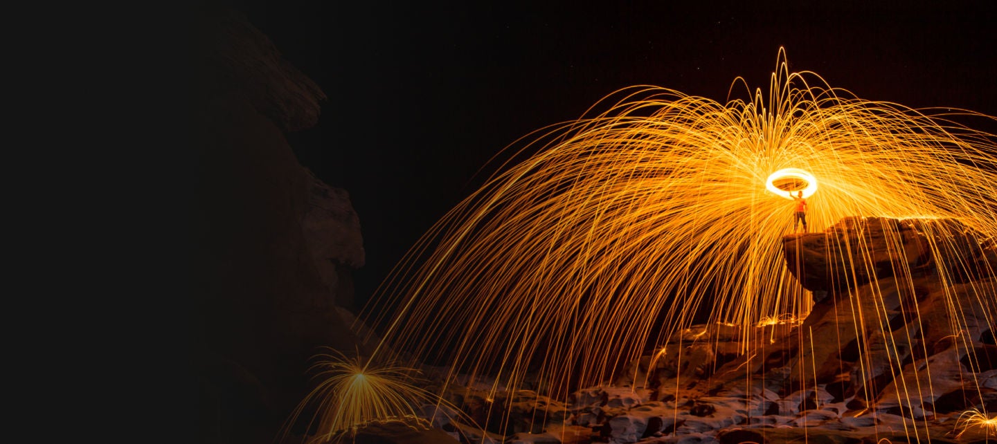 Orange sparklers in the night sky