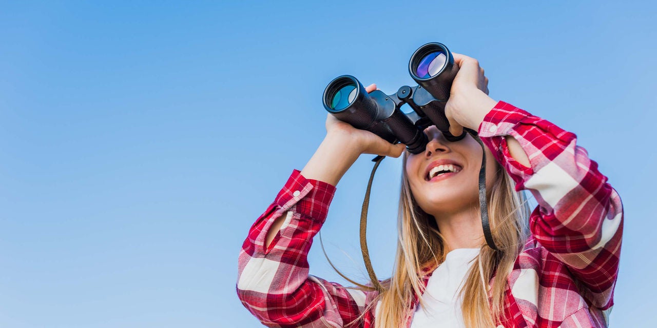 Woman using binoculars