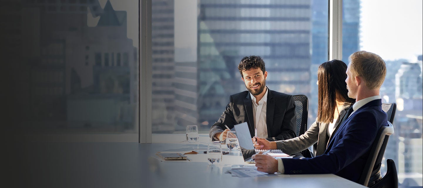 Business people working in boardroom.