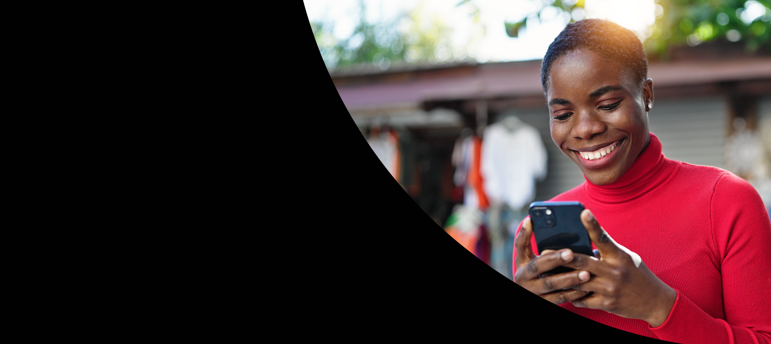 Woman looking at phone smiling