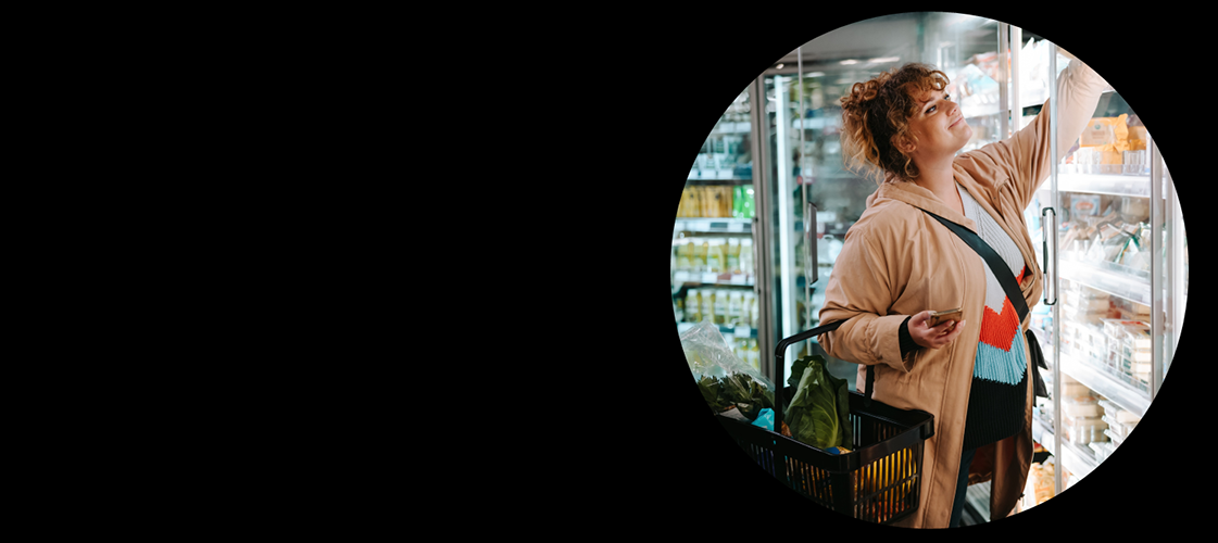 Woman shopping in the dairy section in the grocery store
