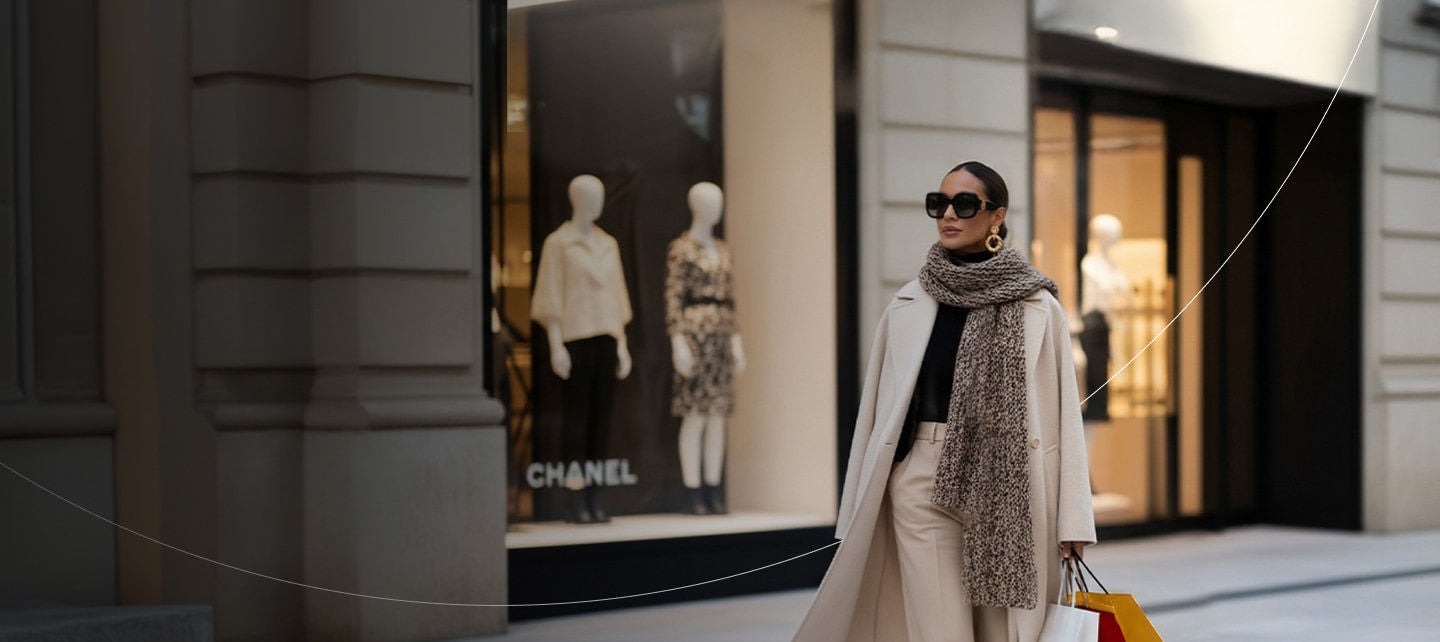 fashionable woman carrying shopping bags