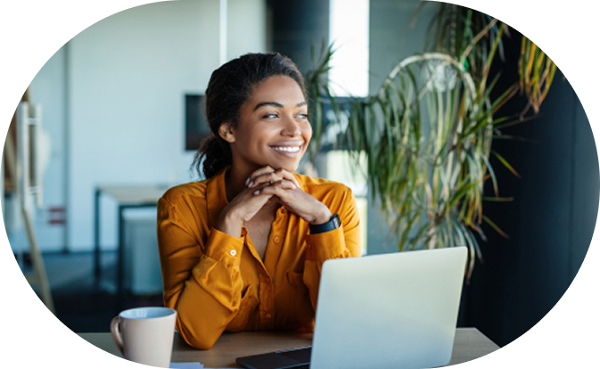 Smiling woman in front of laptop