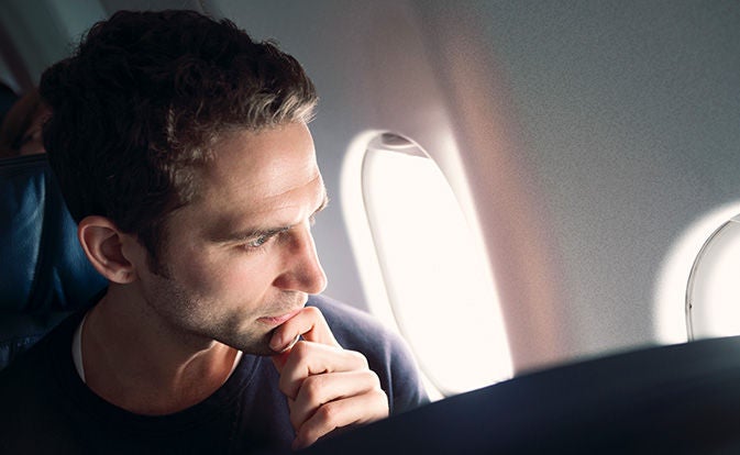 Man thinking on a plane