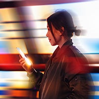 young asian businesswoman using phone at office.