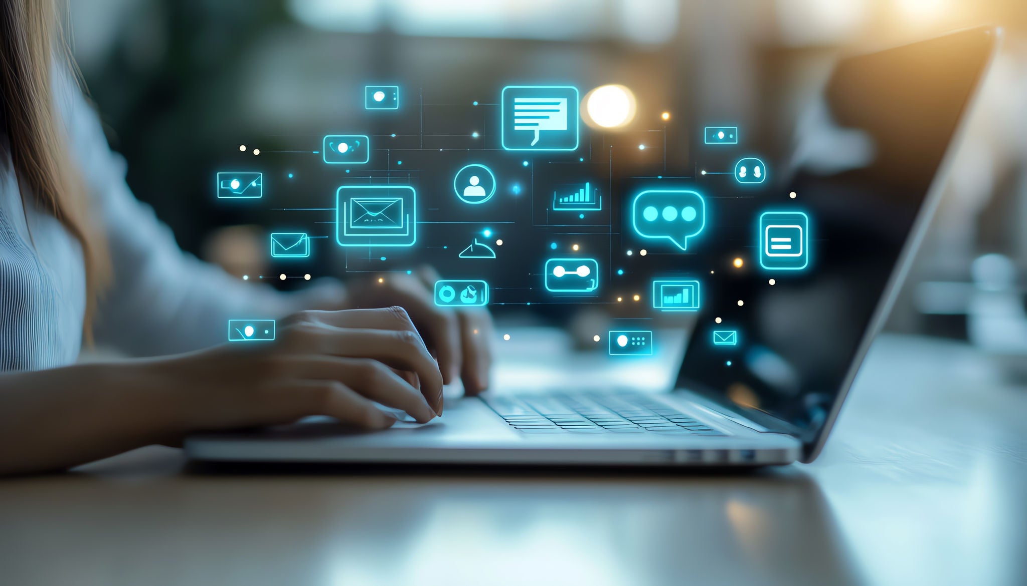 Abstract image of person typing on keyboard and icons floating above keyboard.