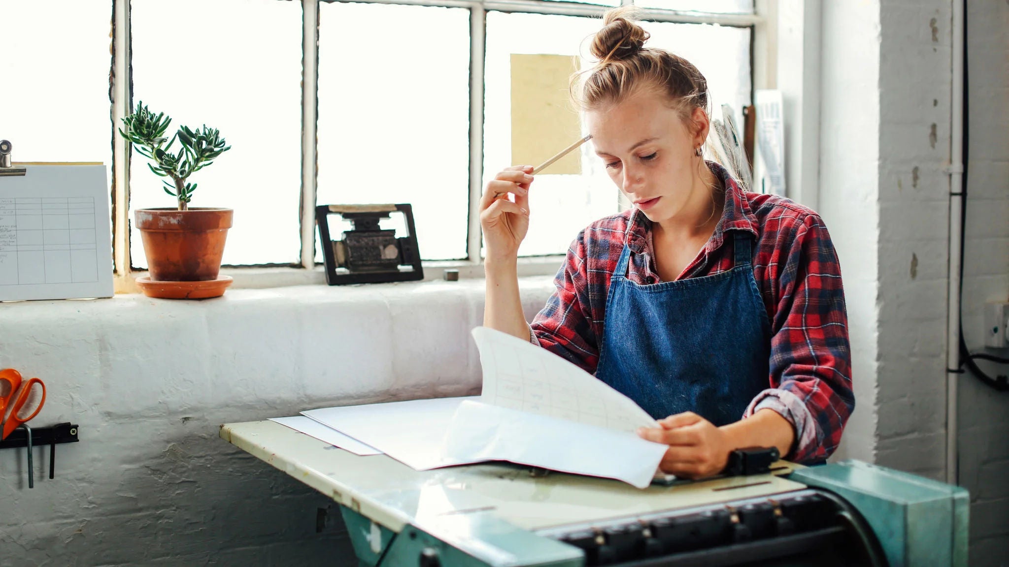 Small business owner reviewing finances