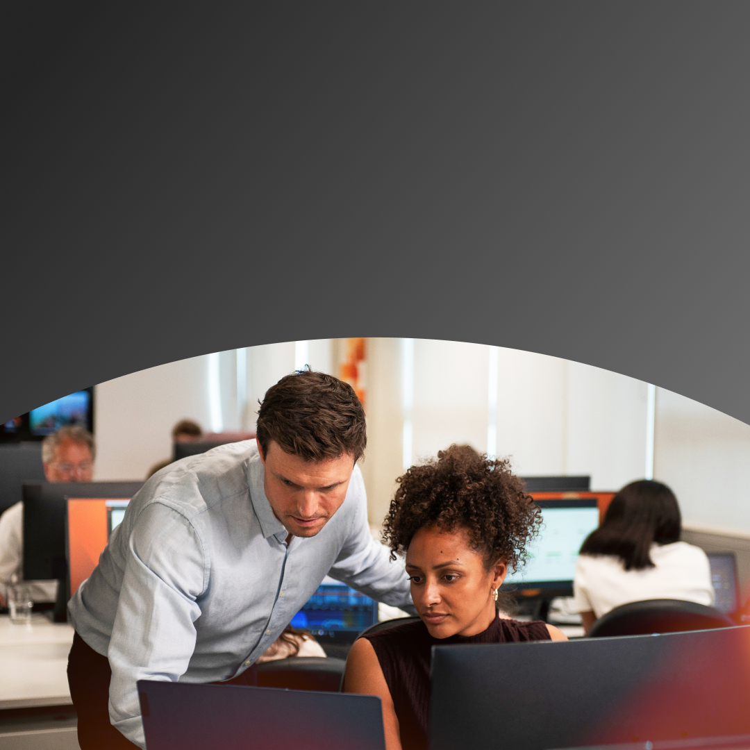 Man and woman looking at computer screen