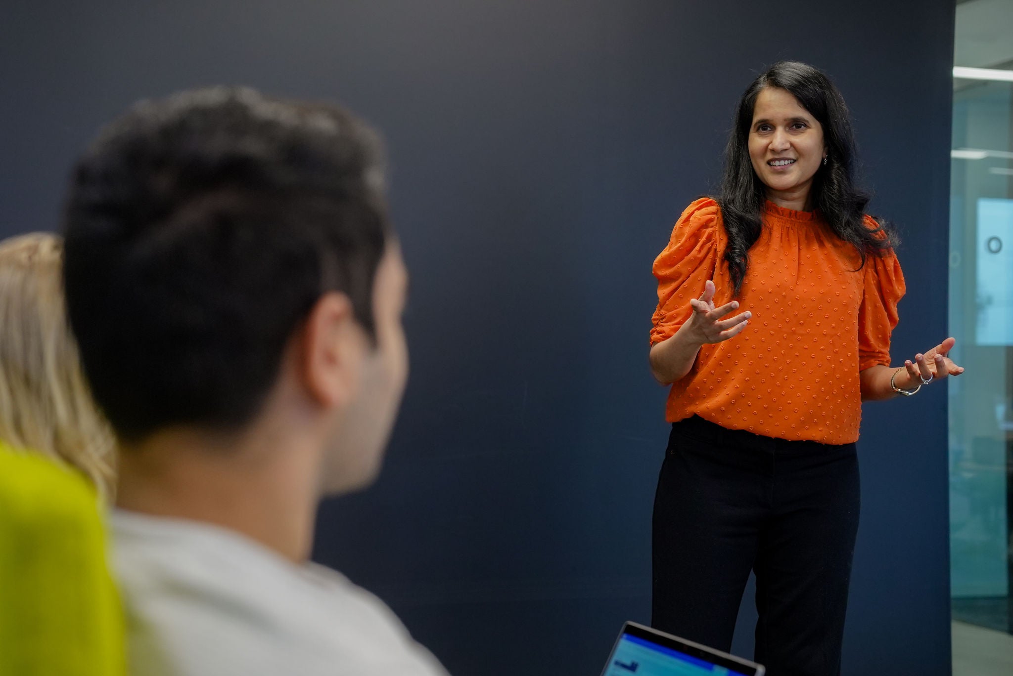 Woman presenting to group of people