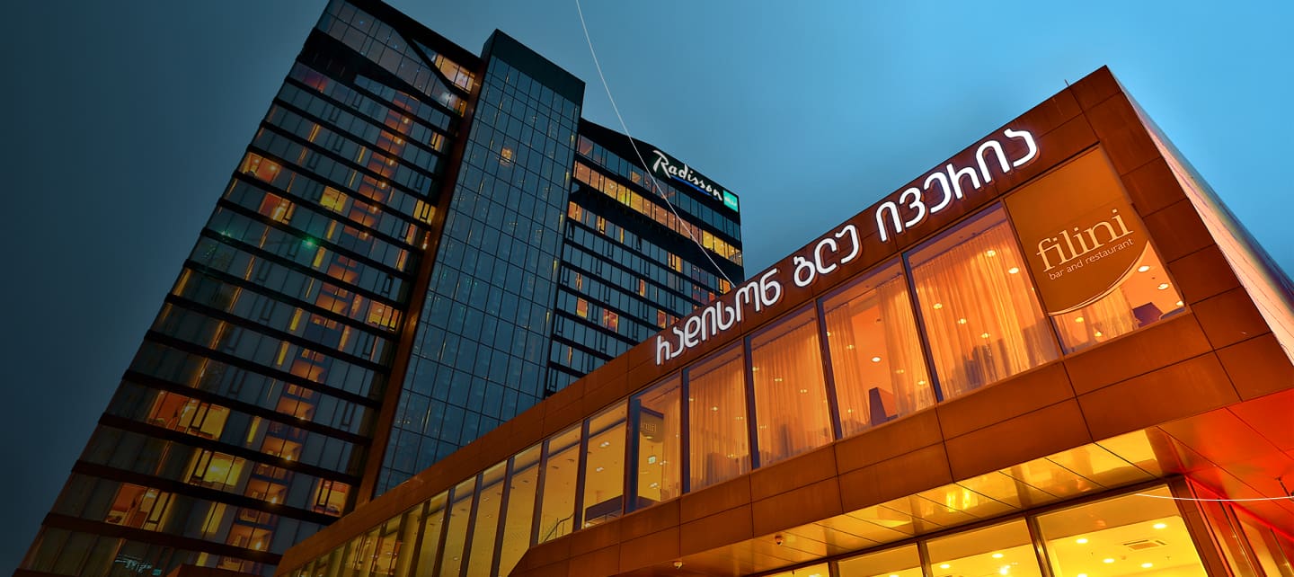 high rise modern hotel at dusk