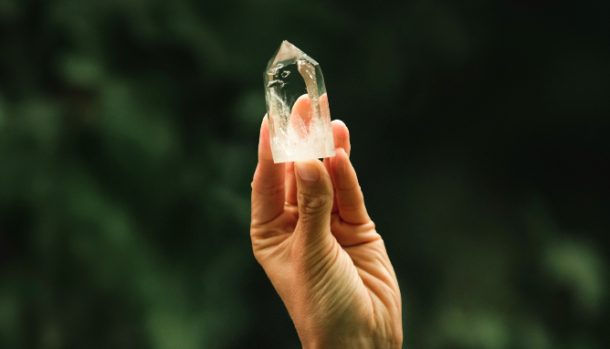 Hand holding a crystal