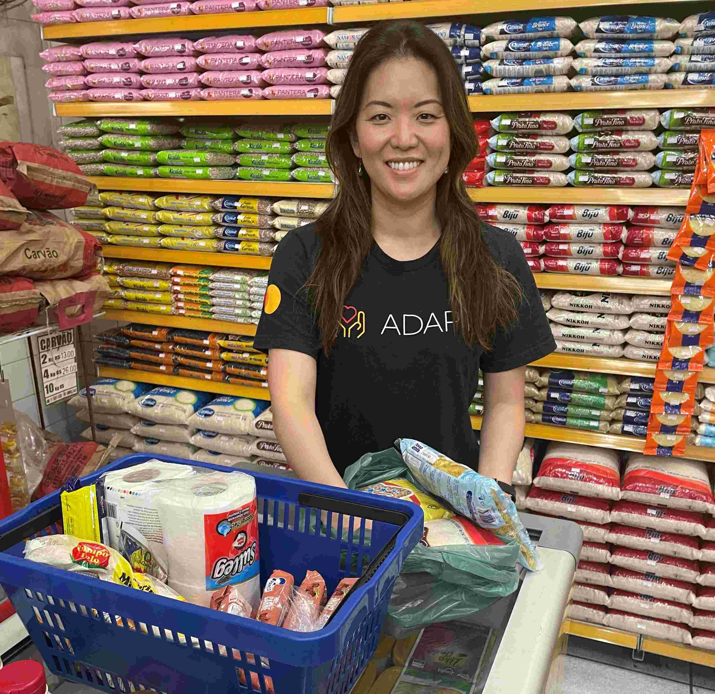 Giselle Miyagi works to create boxes of groceries. 