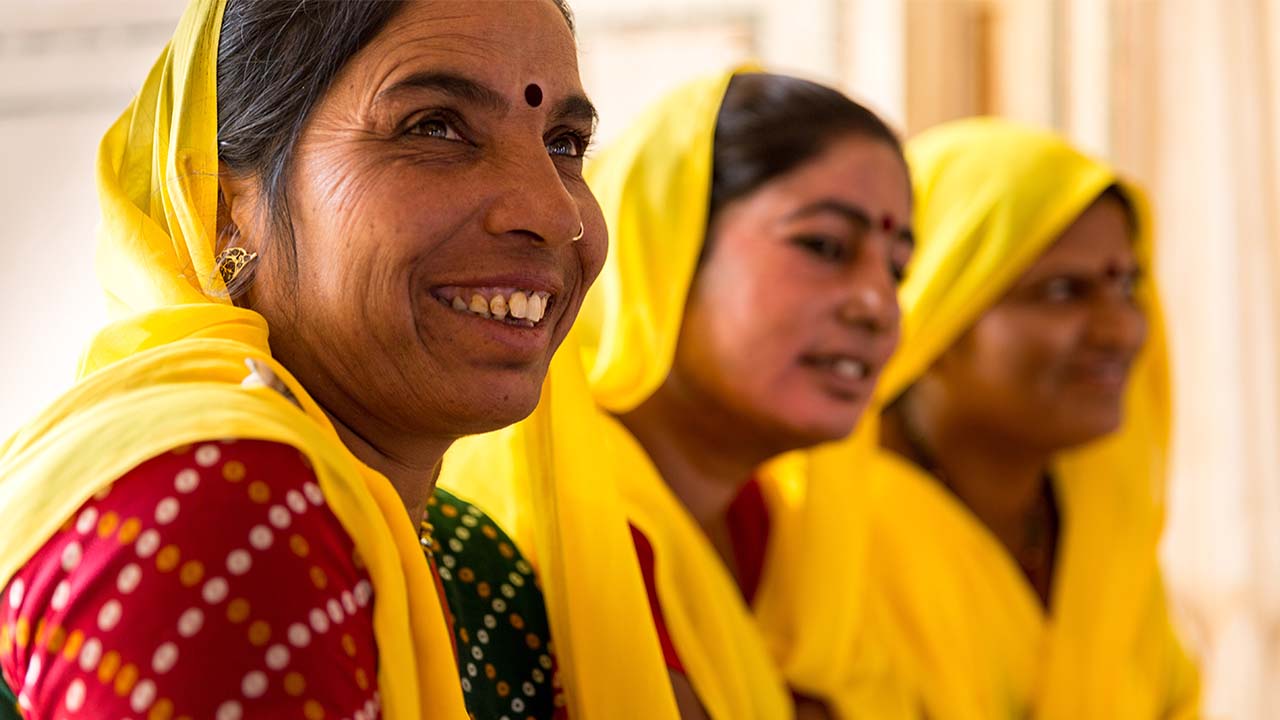 Several women smiling.