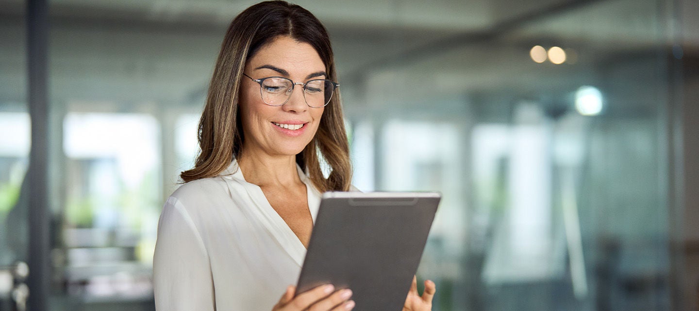 Woman analyzing data on her tablet