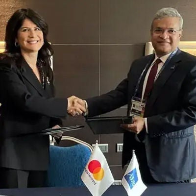 Two collegues are shaking hands at alliance meeting. 