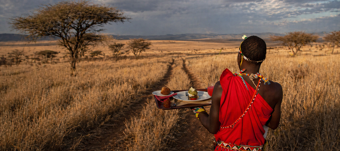 Africa woman hold a plate of food