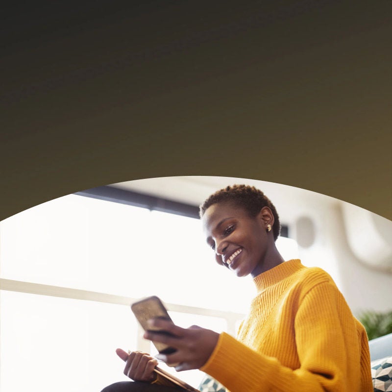 woman in yellow sweater smiling