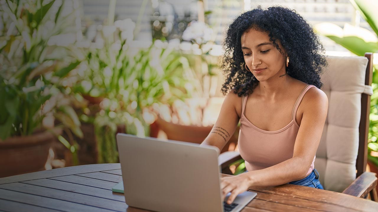 Woman typing on laptop