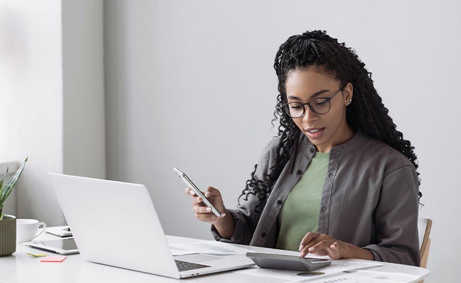 Woman using a calculator