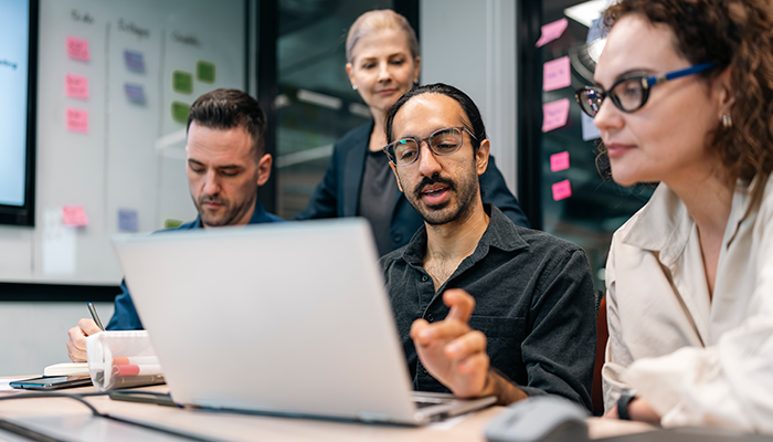 Man explaining the project to his co-workers