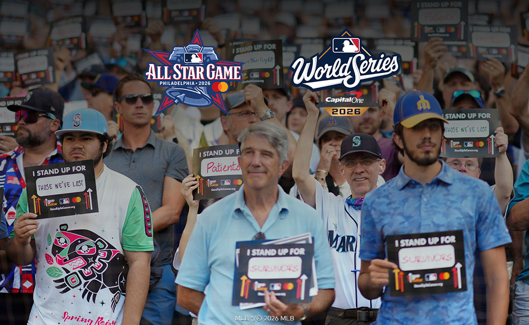 A crowd at an MLB game holds signs to support Stand Up To Cancer, with logos for the All-Star Game and World Series shown.