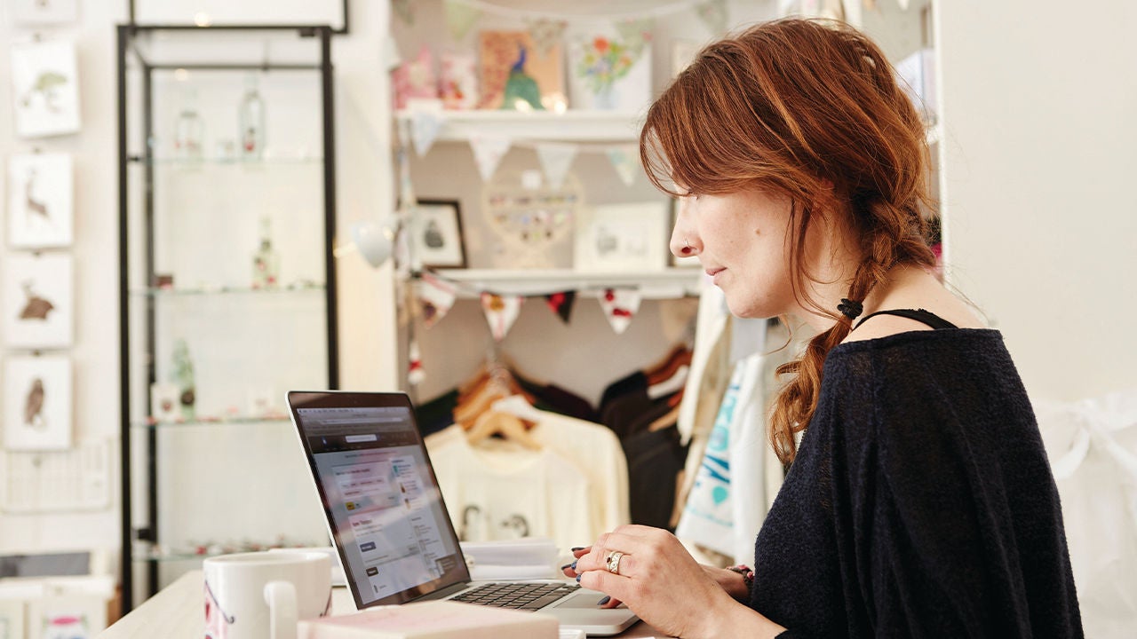 Woman using laptop.