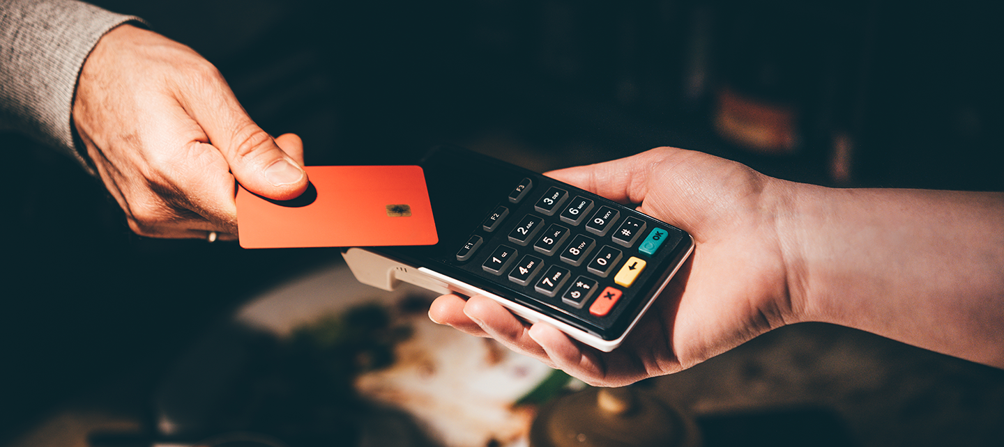 Someone paying with card at the store