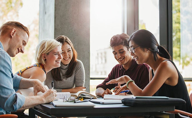 Group of coworkers collaborating around a table.