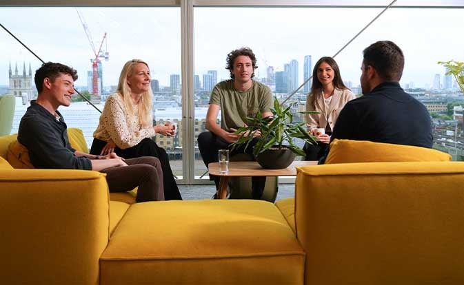 Group of coworkers collaborating around a table.