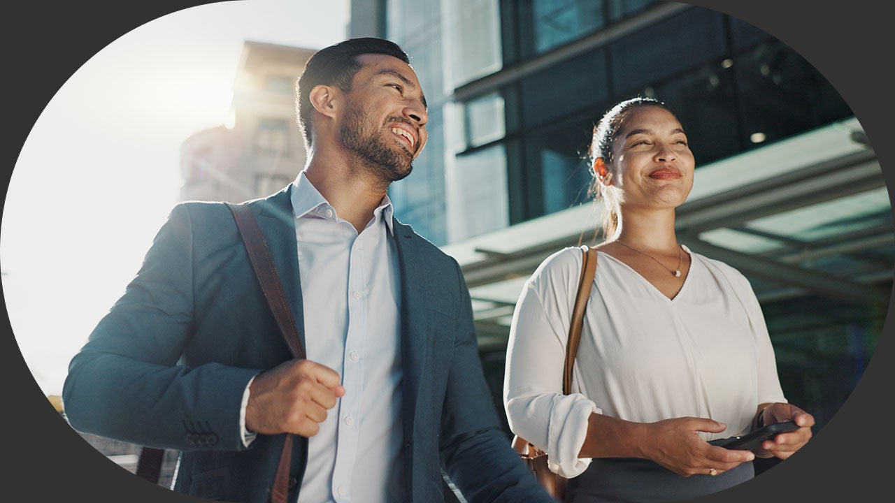 Colleagues walking together to office.
