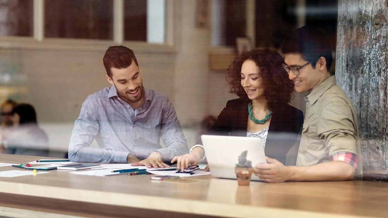 A close-up image of a chain illuminated by orange lights.