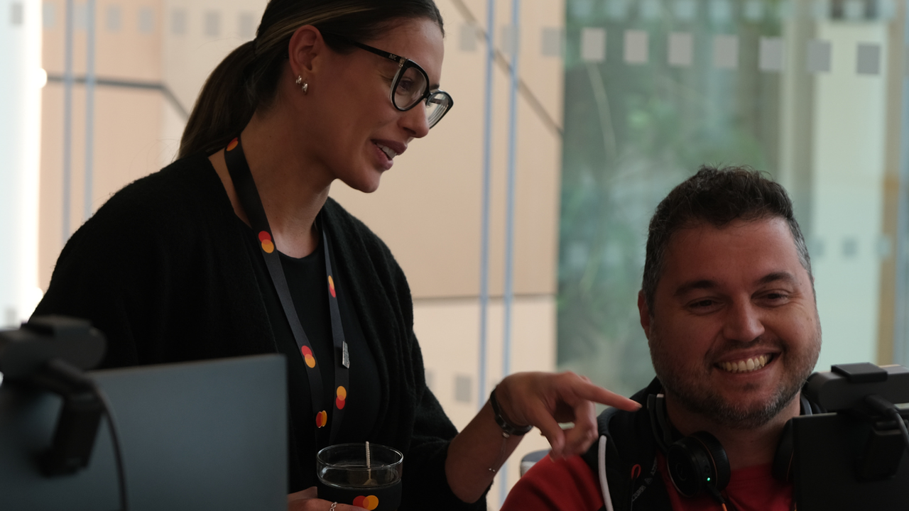 Two employees smiling together