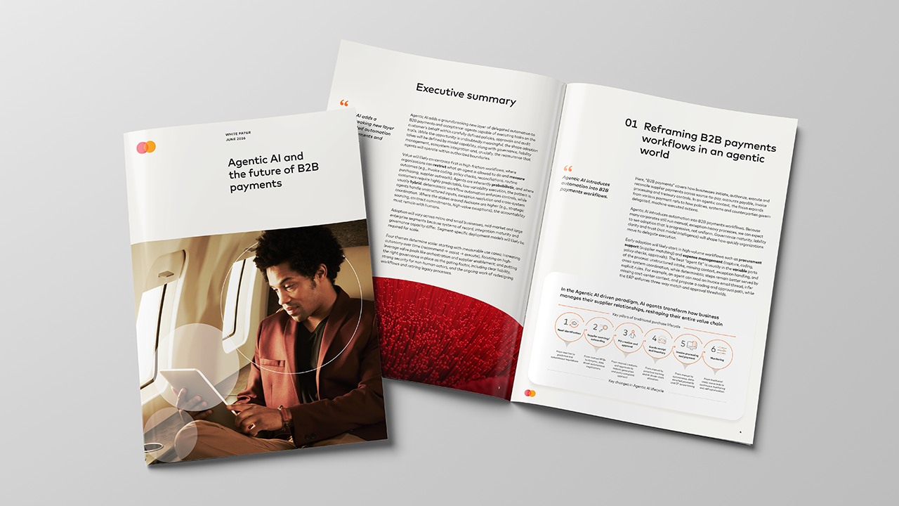 Report with image of a man on an airplane looking at his tablet