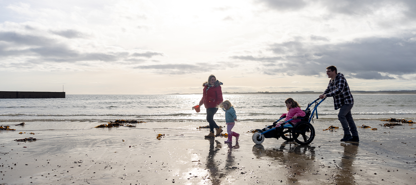 Family playing at the beach