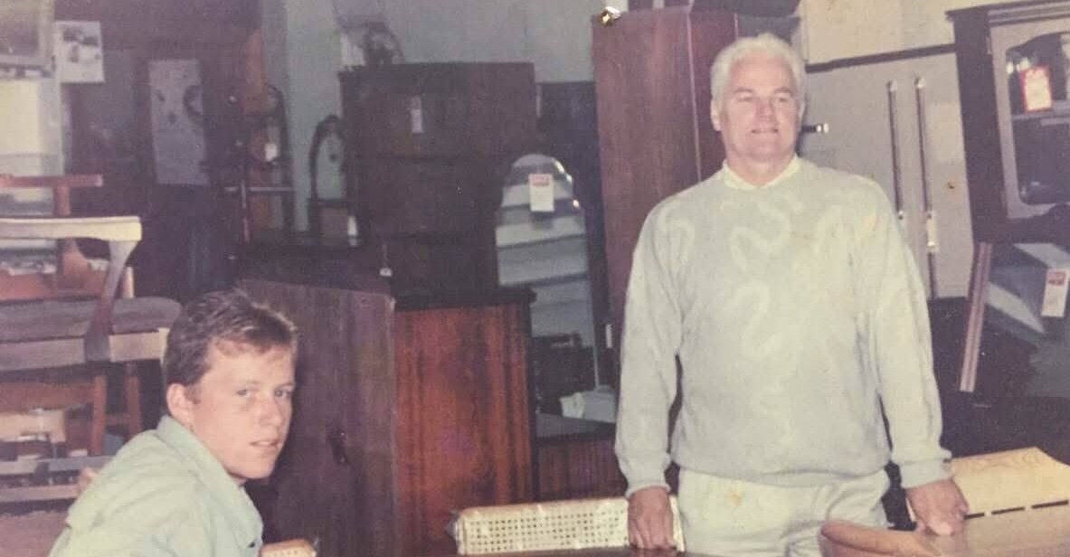 Marcus O'Toole and his father in their furniture store. 