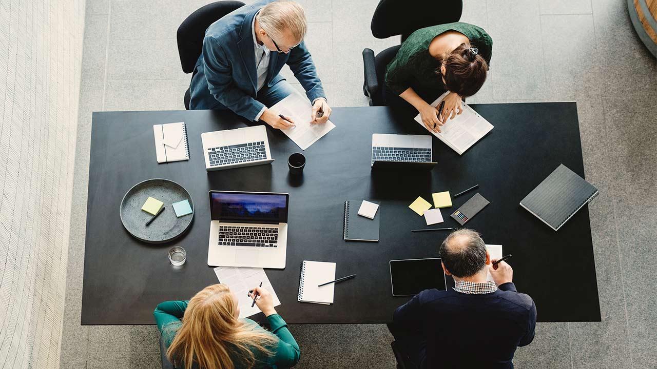 Peacock logo over a background of some Peacock shows.