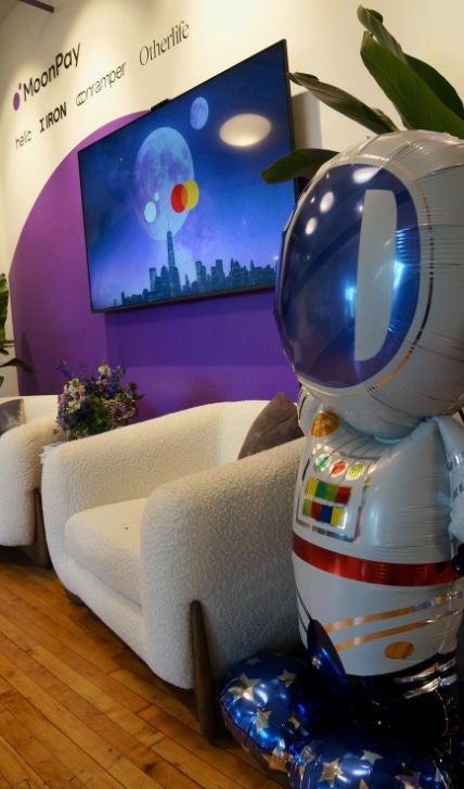 A balloon spaceman in the lobby of MoonPay. 