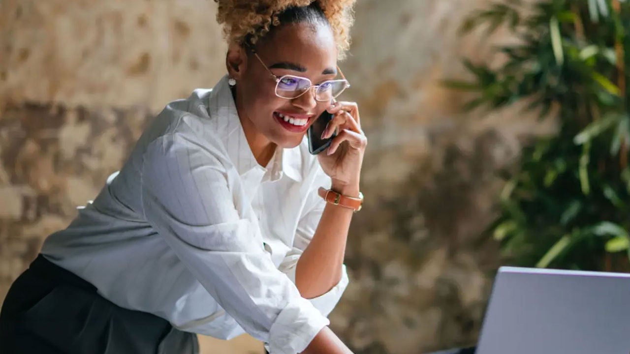 Woman smiling looking at computer
