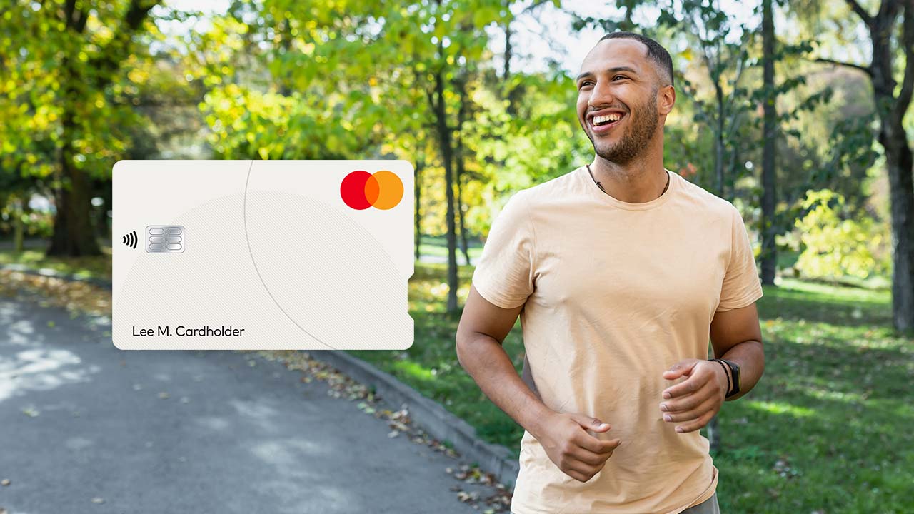 Man jogging in a park and an image of a Mastercard credit card.